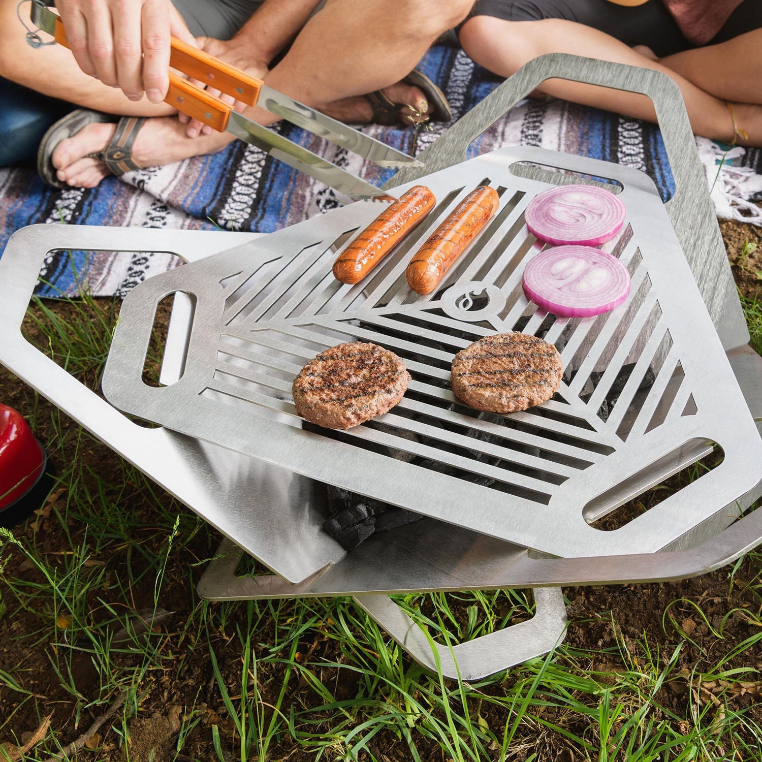 Fireflower Original backyard firepit with grill in use