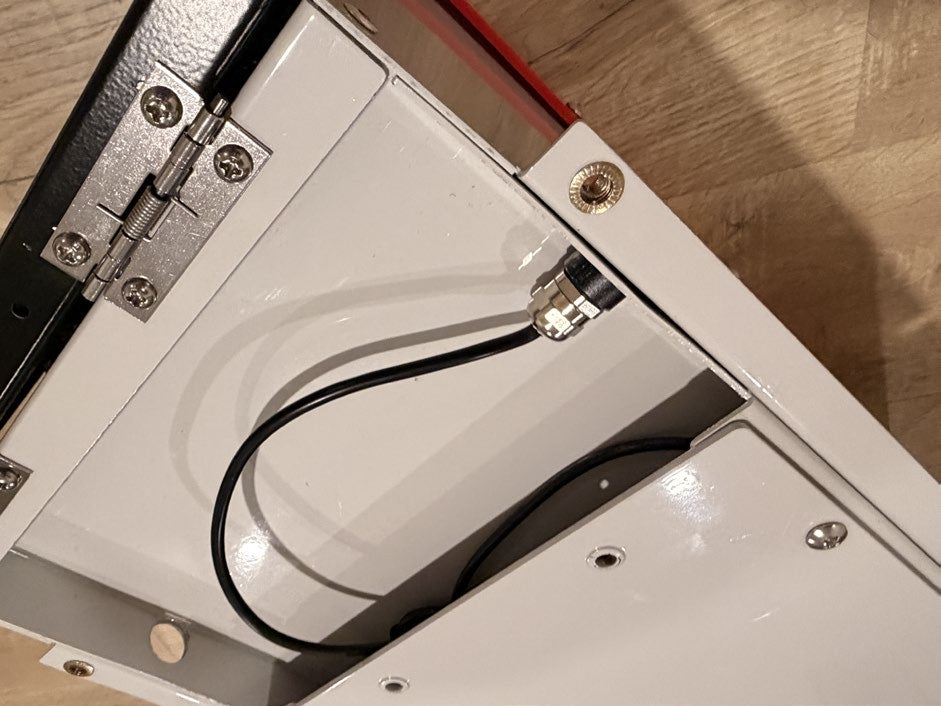Feed wires under mounting bracket and through hole